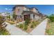 Beautiful two-story home with desert landscaping, a covered porch, and a sidewalk at 6208 Rathbone St, Las Vegas, NV 89166