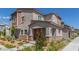 Charming home showcasing stucco exterior, manicured landscaping, and covered porch at 6208 Rathbone St, Las Vegas, NV 89166