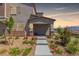 Inviting home entrance with a landscaped walkway and picturesque desert surroundings at 6208 Rathbone St, Las Vegas, NV 89166