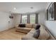 Comfortable living room with a sectional sofa, natural light, and modern decor at 6208 Rathbone St, Las Vegas, NV 89166