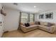 Cozy living room with modern decor, including a comfortable sectional sofa and contemporary artwork at 6208 Rathbone St, Las Vegas, NV 89166