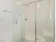 Shower features tile surround, glass door, and built in bench at 6208 Rathbone St, Las Vegas, NV 89166