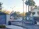 Secured community entrance gate with palm trees at 6250 W Flamingo Rd # 135, Las Vegas, NV 89103