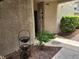 Secured apartment entrance surrounded by landscaping and decorative basket at 6250 W Flamingo Rd # 135, Las Vegas, NV 89103