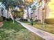 Exterior path through a well-maintained community with mature landscaping at 6250 W Flamingo Rd # 135, Las Vegas, NV 89103