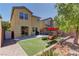 Lush backyard featuring artificial turf, patio, and outdoor seating, perfect for entertaining guests at 6457 Lovett Canyon St, Las Vegas, NV 89148