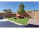 Inviting backyard with artificial turf and ample space for outdoor seating and relaxation at 6457 Lovett Canyon St, Las Vegas, NV 89148