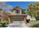 Charming two-story home with a stone-accented front and attached two car garage at 6457 Lovett Canyon St, Las Vegas, NV 89148