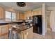 Modern kitchen with stainless steel appliances, granite countertops, and a central island at 6457 Lovett Canyon St, Las Vegas, NV 89148