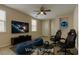 Virtually staged game room with comfy bean bags, gamer chairs, and large screen TV at 6457 Lovett Canyon St, Las Vegas, NV 89148