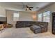 Spacious living room featuring a plush sectional sofa and large windows for ample light at 6457 Lovett Canyon St, Las Vegas, NV 89148