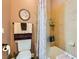 Bathroom featuring tile surround shower/tub, dark wood vinyl flooring and decorative towel rack at 6527 Lokai Ave, Las Vegas, NV 89130