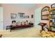 Charming room features a daybed, bookshelf, and decorative wall art, creating a cozy and inviting atmosphere at 6527 Lokai Ave, Las Vegas, NV 89130