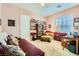Well-lit bedroom featuring a daybed, cozy chair, bookcase, and a charming reading nook perfect for relaxing at 6527 Lokai Ave, Las Vegas, NV 89130