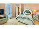 Comfortable bedroom with a sliding glass door to the outside at 6527 Lokai Ave, Las Vegas, NV 89130