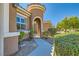 Inviting front gated entrance with beautifully manicured landscaping, providing privacy and curb appeal at 6527 Lokai Ave, Las Vegas, NV 89130