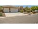 Beautiful, single-story home featuring a neutral color palette, tile roof, and two car garage with a well manicured front yard at 6527 Lokai Ave, Las Vegas, NV 89130