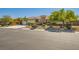 Charming single-story home showcasing a neutral color palette, tile roof, and a beautifully landscaped front yard at 6527 Lokai Ave, Las Vegas, NV 89130