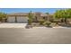 Charming single-story home featuring a neutral color palette, tile roof, two car garage, and well manicured landscaping at 6527 Lokai Ave, Las Vegas, NV 89130