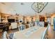 Spacious open-concept living room featuring a fireplace, chandelier, and access to kitchen at 6527 Lokai Ave, Las Vegas, NV 89130