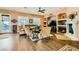 Comfortable living room with a fireplace, ample seating, and natural light from large windows at 6527 Lokai Ave, Las Vegas, NV 89130