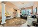 Elegant living room featuring hardwood floors, sophisticated decor, and abundant natural light at 6527 Lokai Ave, Las Vegas, NV 89130