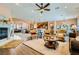 Open-concept living area with fireplace and seamless flow into the kitchen and dining spaces at 6527 Lokai Ave, Las Vegas, NV 89130