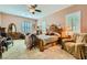 Cozy main bedroom with a ceiling fan, carpeted floor and shuttered windows at 6527 Lokai Ave, Las Vegas, NV 89130