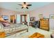 Spacious main bedroom featuring neutral walls, carpeting, and double doors at 6527 Lokai Ave, Las Vegas, NV 89130
