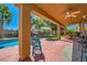 Spacious covered patio overlooking the pool, ideal for outdoor dining and relaxation at 6527 Lokai Ave, Las Vegas, NV 89130