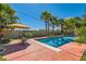 Backyard pool surrounded by lush landscaping, creating a serene and private oasis at 6527 Lokai Ave, Las Vegas, NV 89130