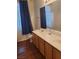 Bright bathroom featuring a double sink vanity, white countertops, and modern fixtures at 700 Carnegie St # 2013, Henderson, NV 89052