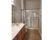 Bathroom features single sink vanity, tile flooring, and a glass shower with gold trim at 700 Carnegie St # 2013, Henderson, NV 89052