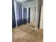 Bedroom with carpet flooring and large mirror closet doors and dark blue curtains at 700 Carnegie St # 2013, Henderson, NV 89052
