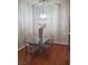 The dining room is complimented by a glass table and modern lighting at 700 Carnegie St # 2013, Henderson, NV 89052