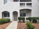 Inviting condo exterior with landscaped garden and private entrance and covered balcony at 700 Carnegie St # 2013, Henderson, NV 89052