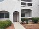 Inviting condo exterior with landscaped garden and private entrance and covered balcony with ceiling fan at 700 Carnegie St # 2013, Henderson, NV 89052