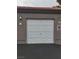 Single car garage with white door at 700 Carnegie St # 2013, Henderson, NV 89052