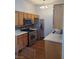 Kitchen features stainless steel appliances including a gas range, refrigerator, and microwave oven at 700 Carnegie St # 2013, Henderson, NV 89052