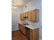 Well-lit kitchen featuring wood cabinets, laminate countertops, and a stainless steel dishwasher at 700 Carnegie St # 2013, Henderson, NV 89052