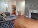 The living room and dining area combination featuring hardwood floors and a fireplace at 700 Carnegie St # 2013, Henderson, NV 89052