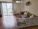 The stylish living room with hardwood floors, sliding doors to the balcony, and neutral decor at 700 Carnegie St # 2013, Henderson, NV 89052