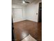 A bright bedroom features hardwood floors and window blinds at 7255 W Sunset Rd # 2093, Las Vegas, NV 89113
