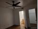 Bedroom with wood floor, open closet door, and entrance to a bathroom at 7255 W Sunset Rd # 2093, Las Vegas, NV 89113