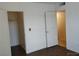 Bedroom with wood floors, neutral paint, closet, and bright natural light at 7255 W Sunset Rd # 2093, Las Vegas, NV 89113