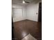 A bright bedroom features hardwood floors and window blinds at 7255 W Sunset Rd # 2093, Las Vegas, NV 89113