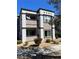 Exterior of condo featuring a charming two-story layout with a private balcony and stairs at 7255 W Sunset Rd # 2093, Las Vegas, NV 89113