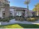 Beautiful building exterior with manicured landscaping, water feature, and ample parking at 7255 W Sunset Rd # 2093, Las Vegas, NV 89113