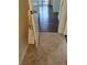 Hallway with dark wood flooring, tile entry, and white doors at 7255 W Sunset Rd # 2093, Las Vegas, NV 89113