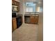 Efficient kitchen with stainless steel dishwasher and wooden cabinets at 7255 W Sunset Rd # 2093, Las Vegas, NV 89113